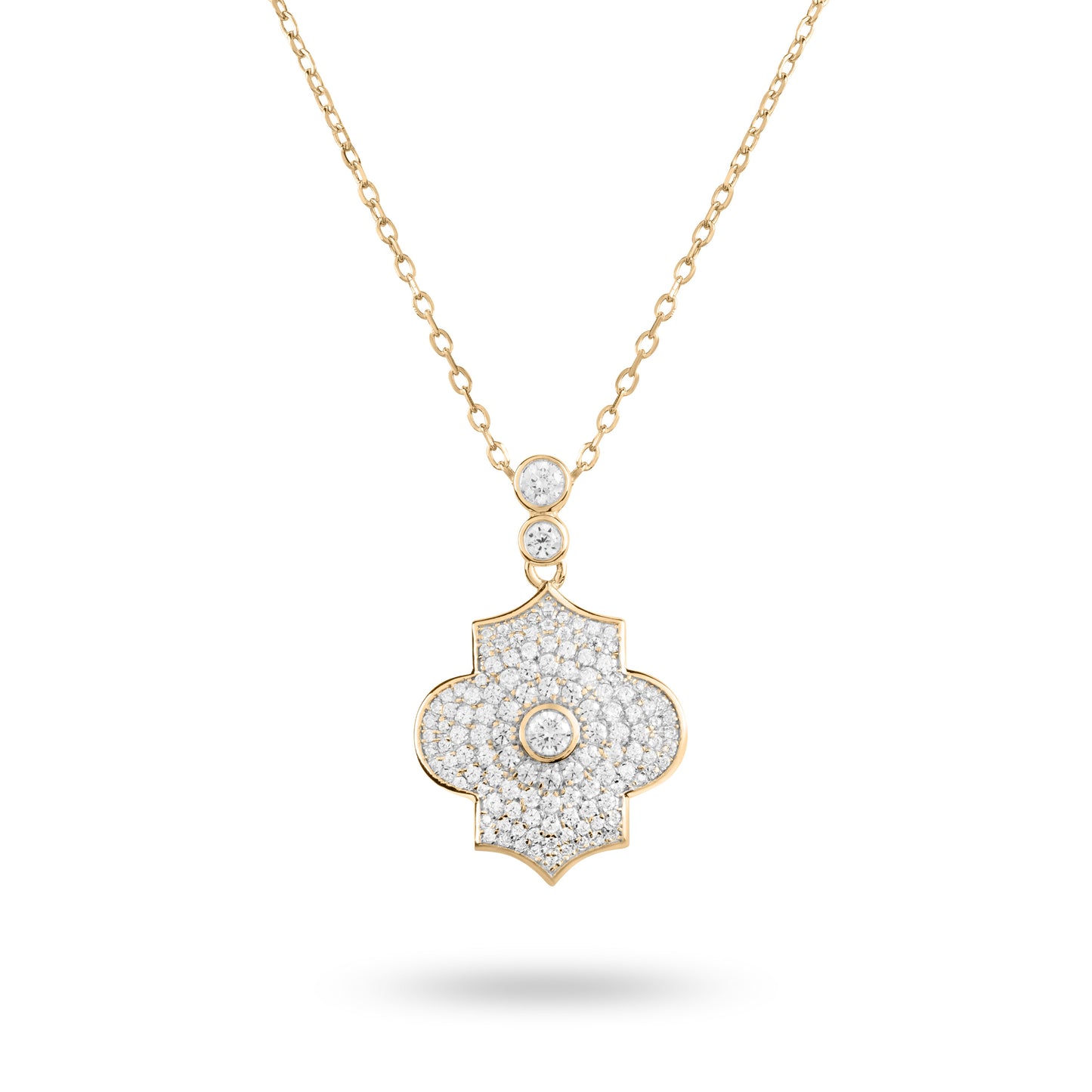 A yellow gold pave necklace featuring a geometric shaped pendant with multiple dangling diamonds.