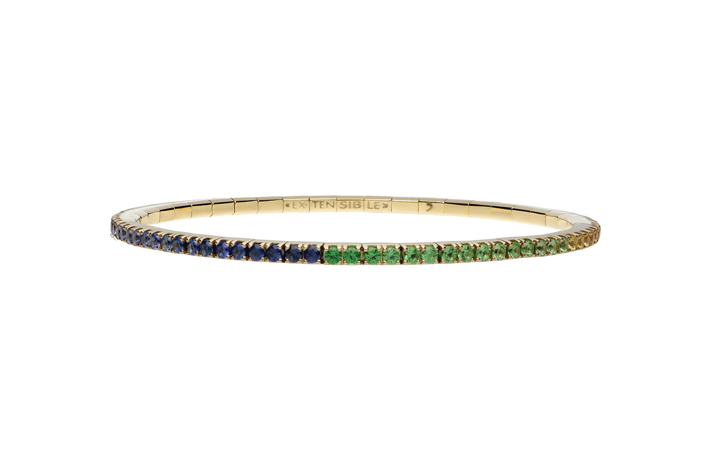 Gold bangle with green and blue gemstones on a white background