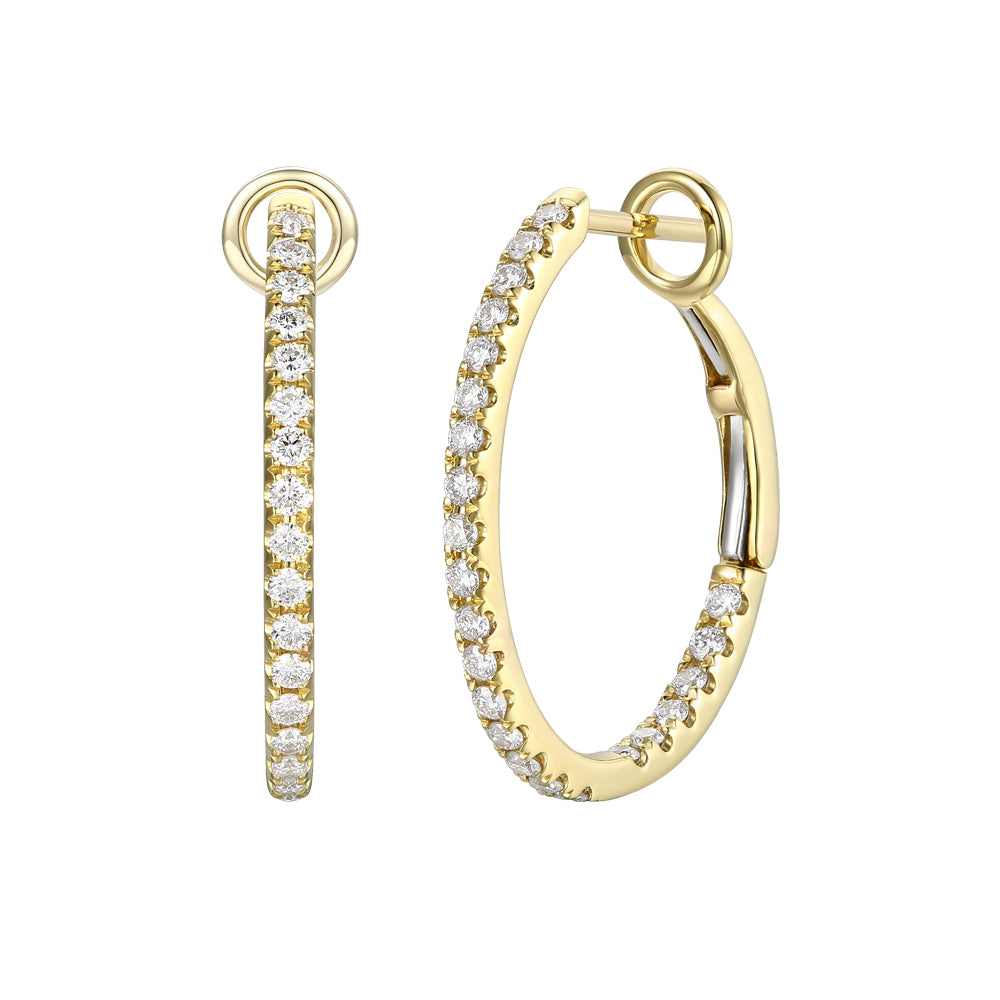 Gold hoop earrings with clear gemstones on a white background