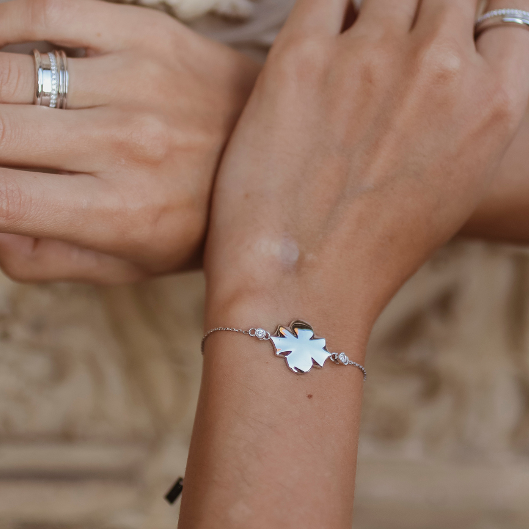 White gold white diamond chain braclet on a models hand