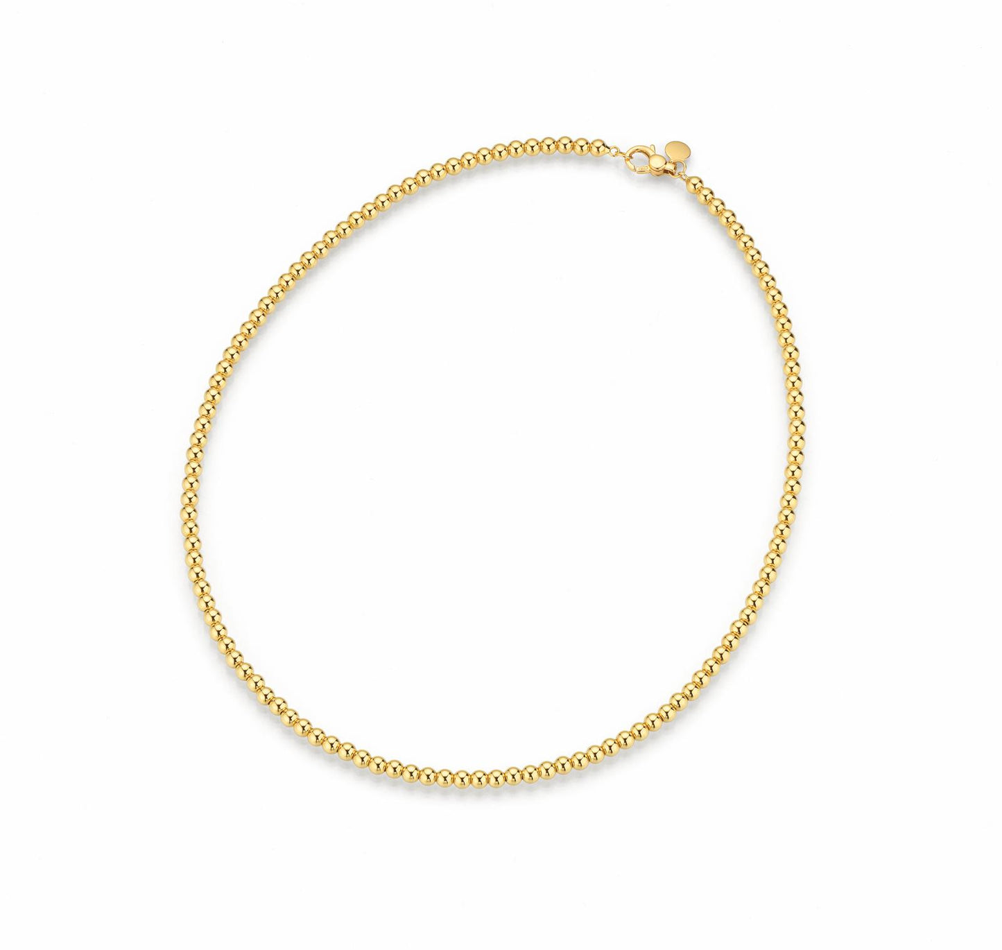 Gold beaded necklace on a white background