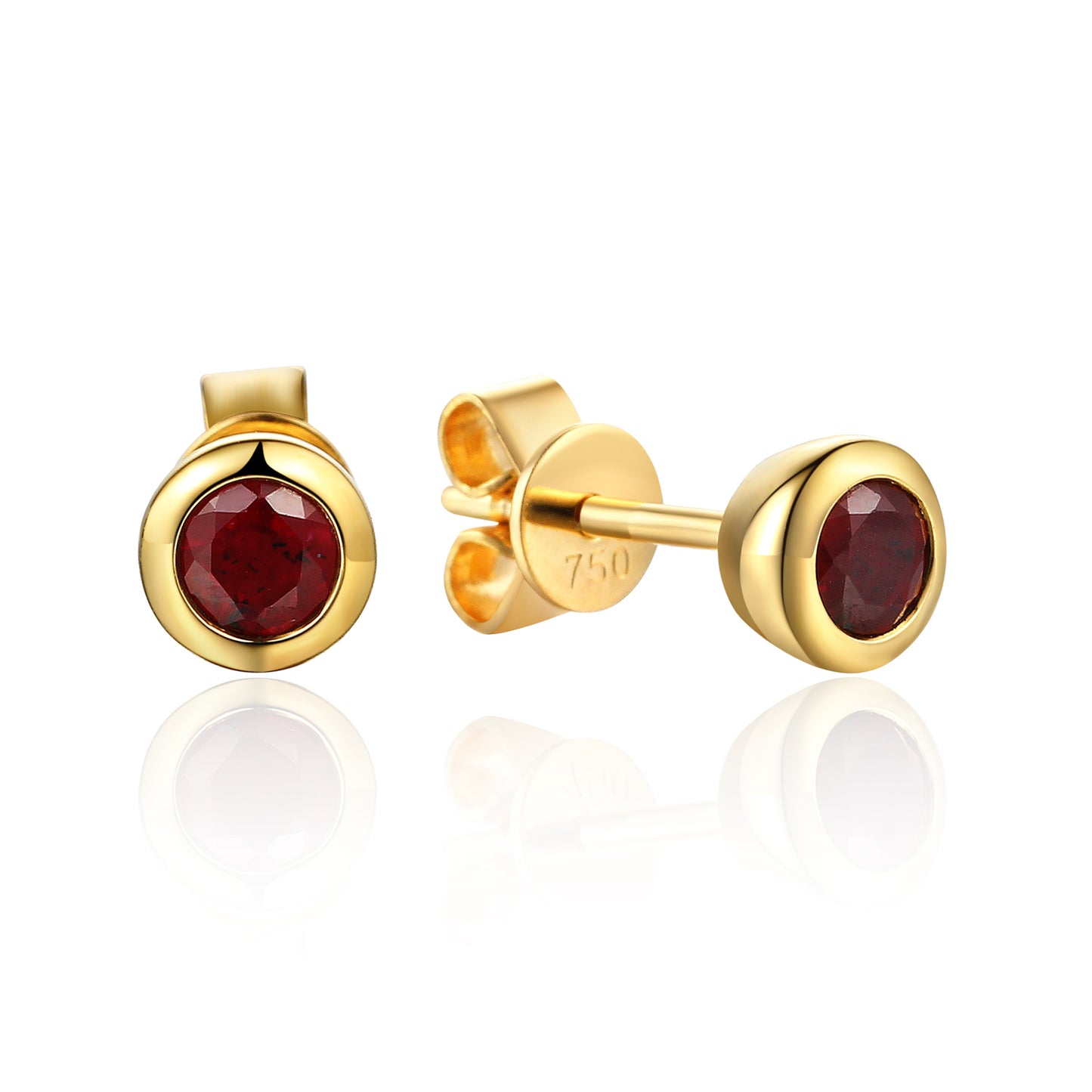 Gold earrings with red gemstones on a white background