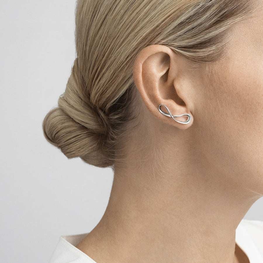 Georg Jensen Silver Infinity Earcuffs worn on a model