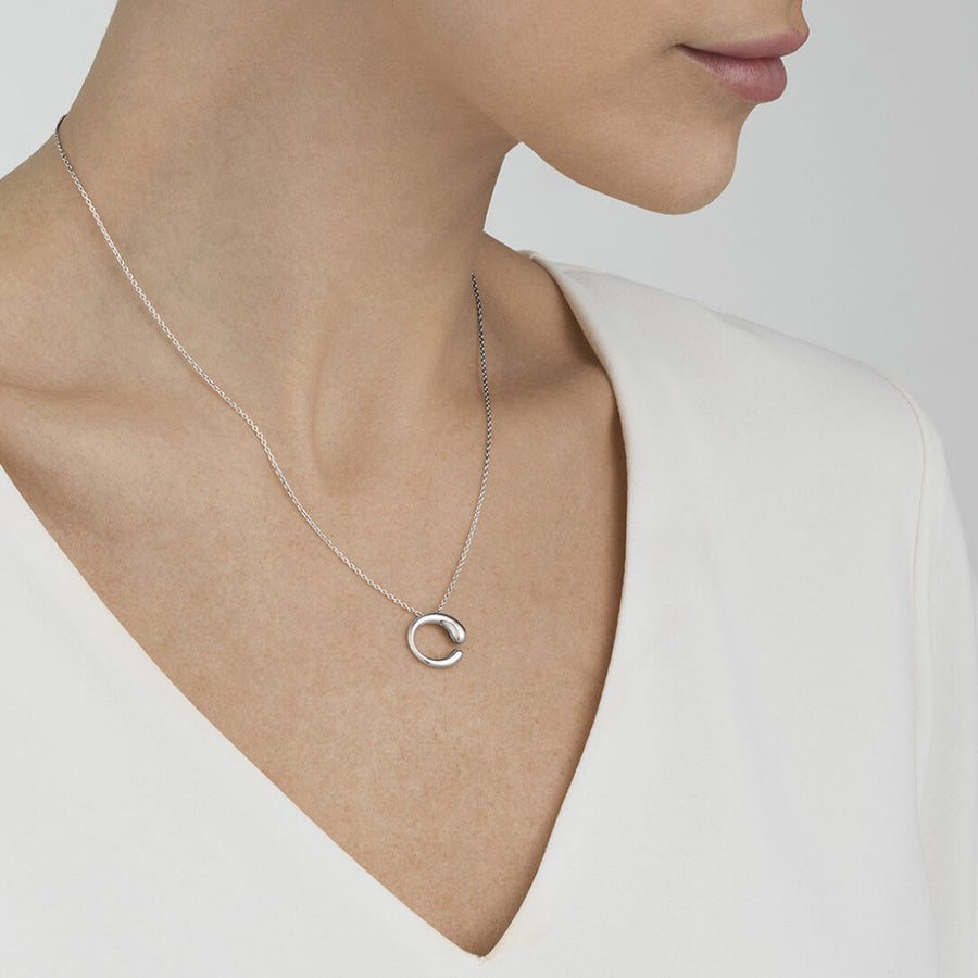 Georg Jensen Mercy Small Silver Pendant worn on a model