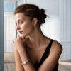 model in a house wearing the Georg Jensen Mercy Hinged Bangle