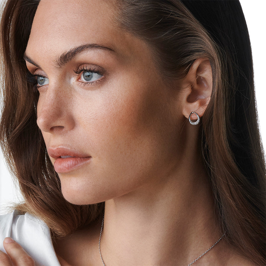 Georg Jensen Offspring Silver And Diamond Earrings worn on a model