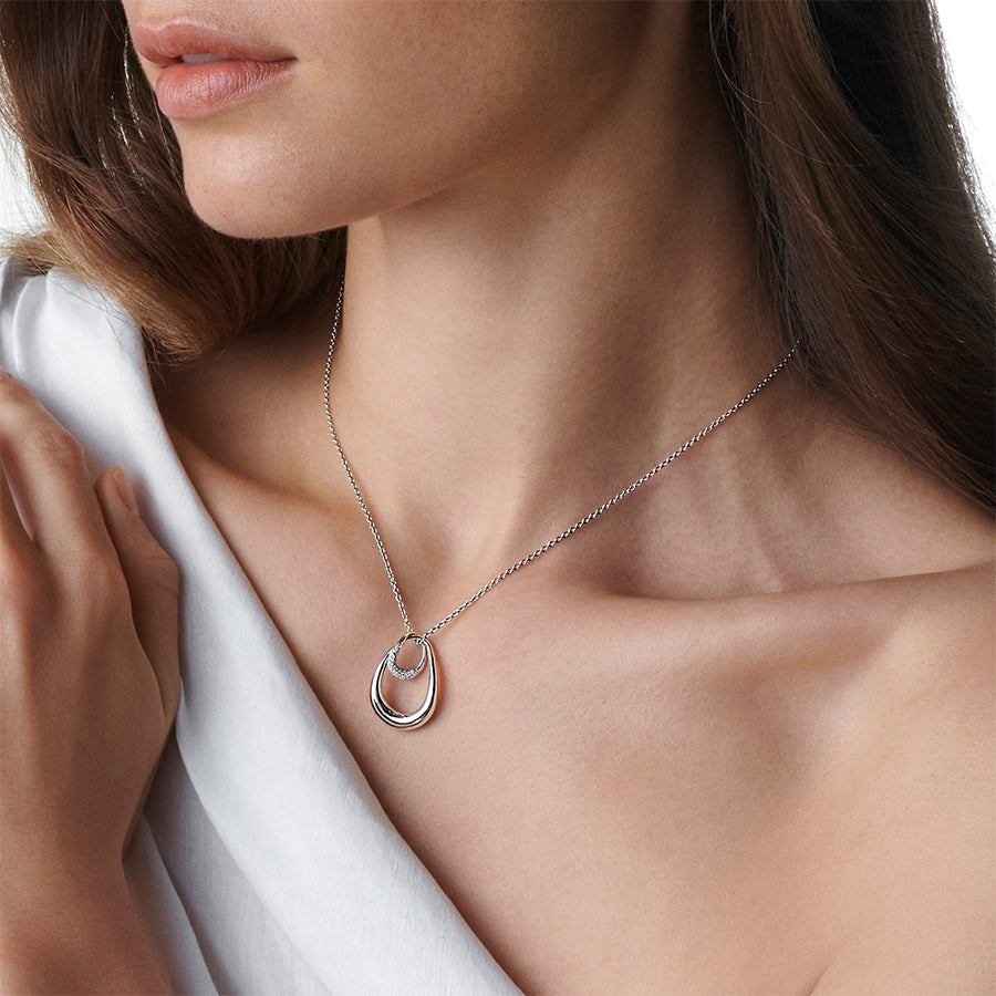 Georg Jensen Offspring Large Silver And Diamond Pendant worn on a model