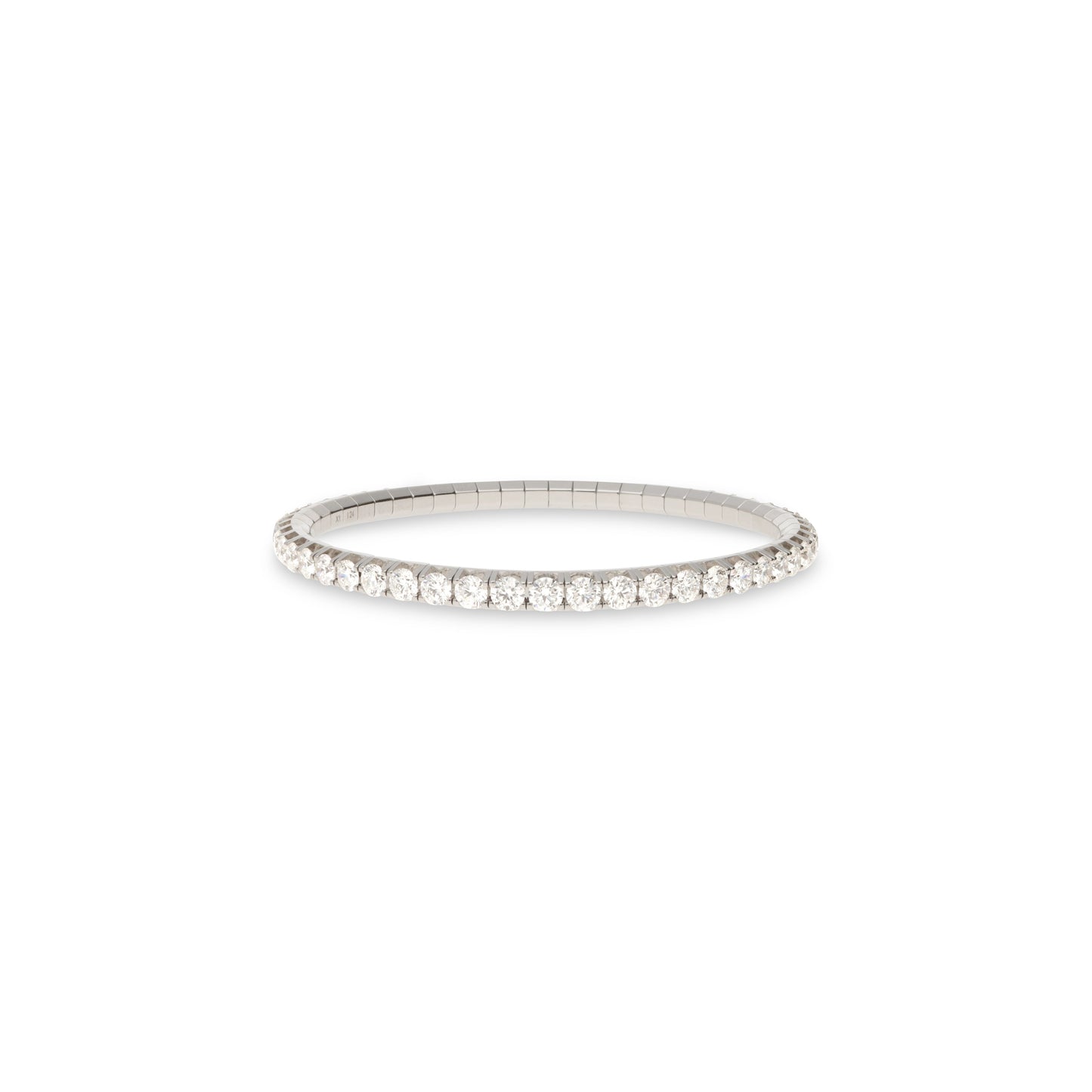 A white gold tennis bracelet with a single row of small clear gemstones, shown against a plain white background.
