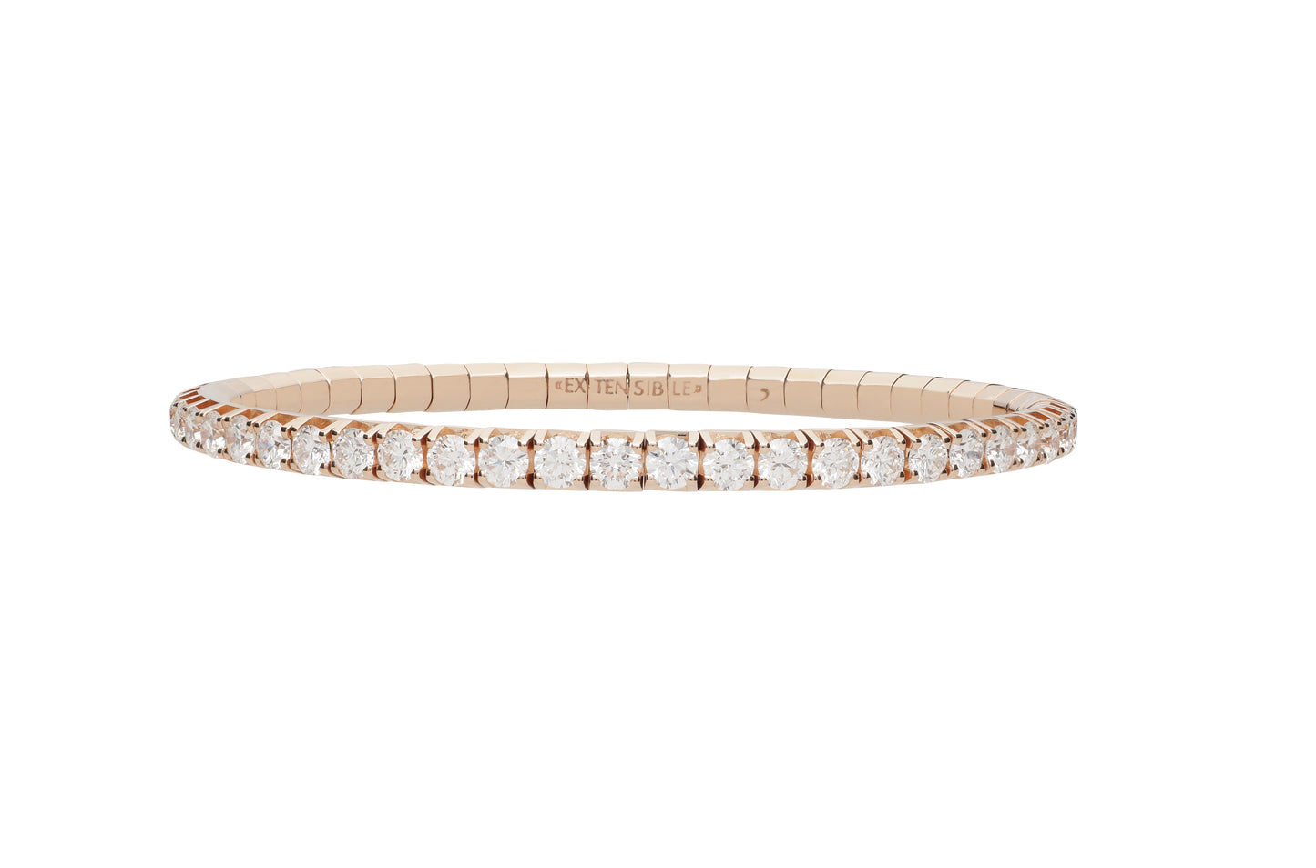 A rose gold tennis bracelet with a continuous row of round-cut clear gemstones, shown against a plain white background.