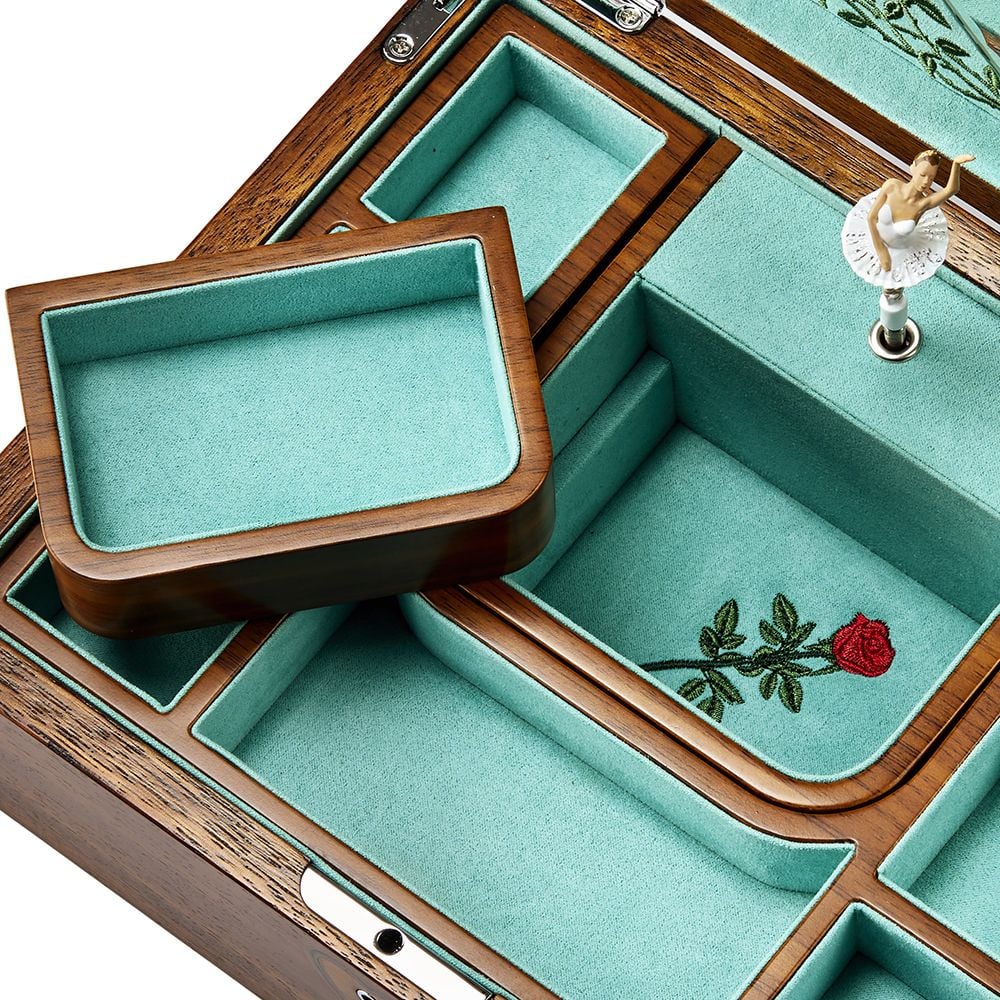 Wooden jewelry box with green velvet interior and embroidered rose design