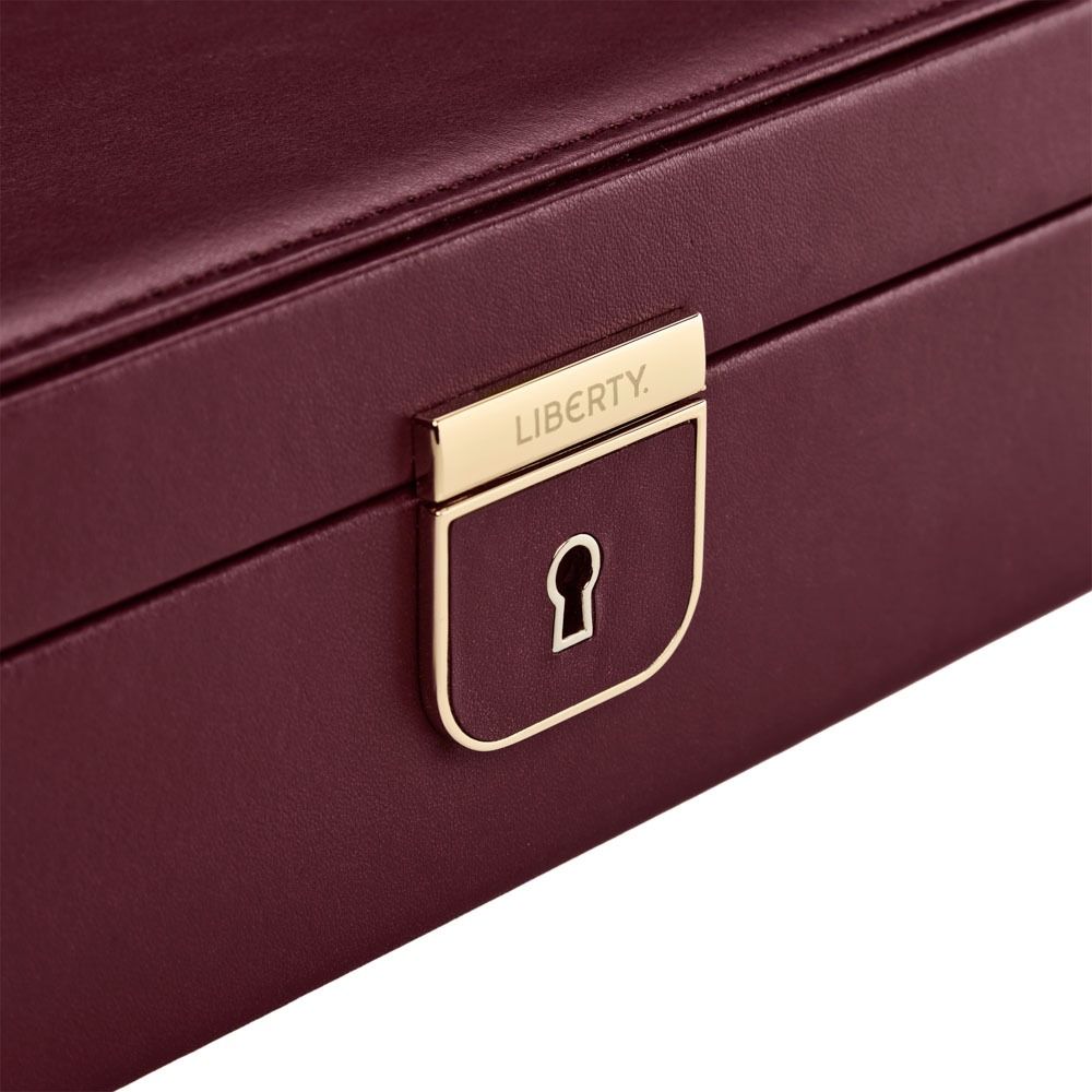 Maroon jewelry box with gold lock and 'Liberty' branding on a white background