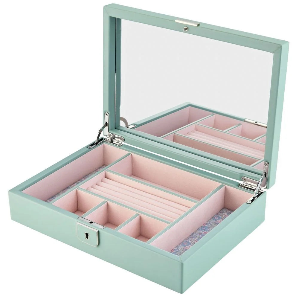 Mint green jewelry box with pink interior on a white background