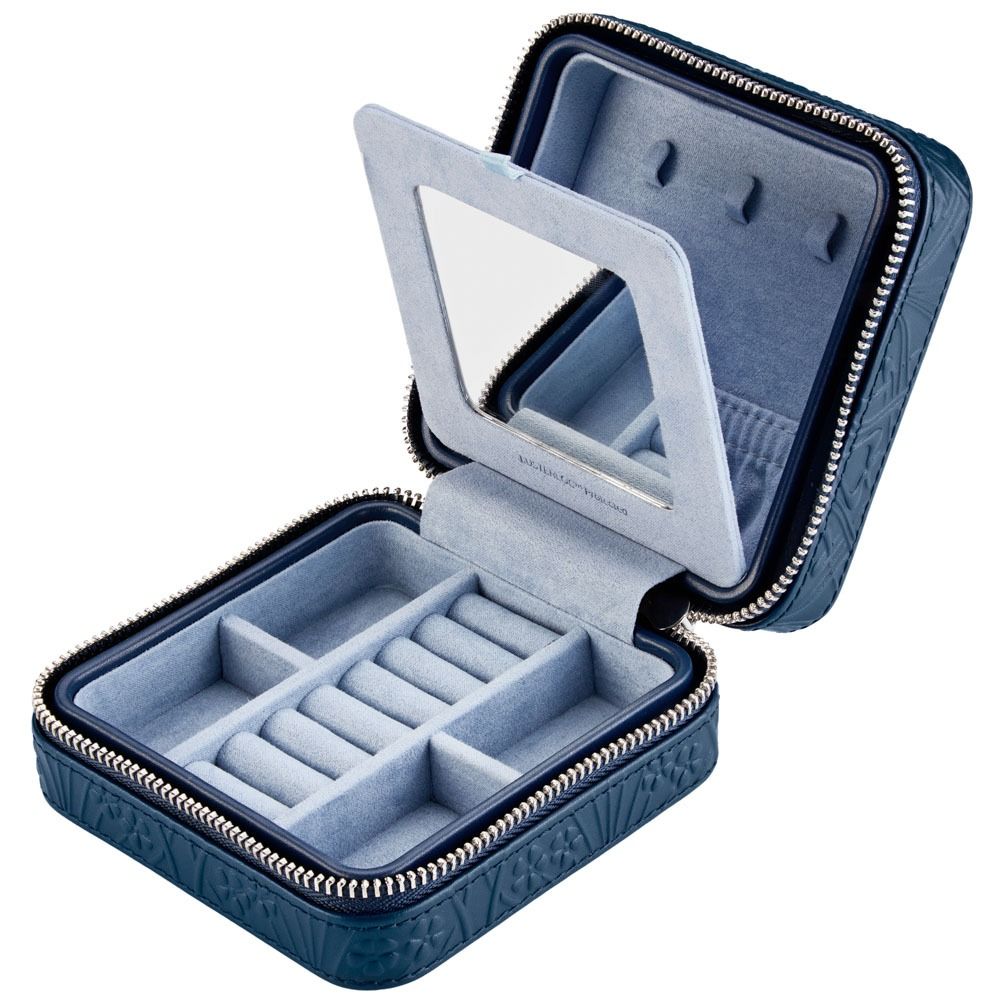 Blue jewelry case with mirror and ring compartments on a white background