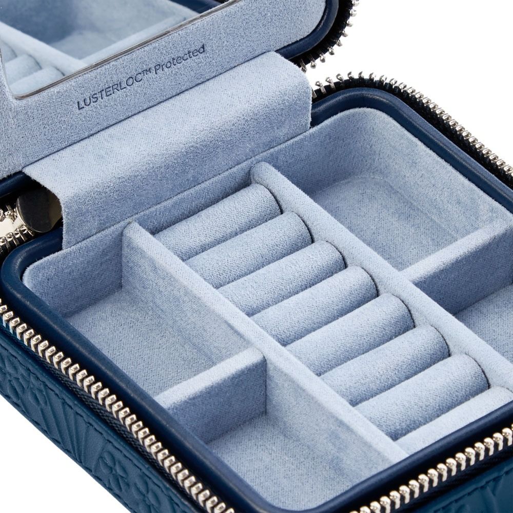 Blue jewelry case with compartments for jewelry, featuring Lusterloc branding.