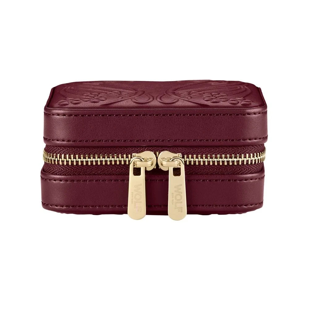 Maroon jewelry box with gold zipper on a white background
