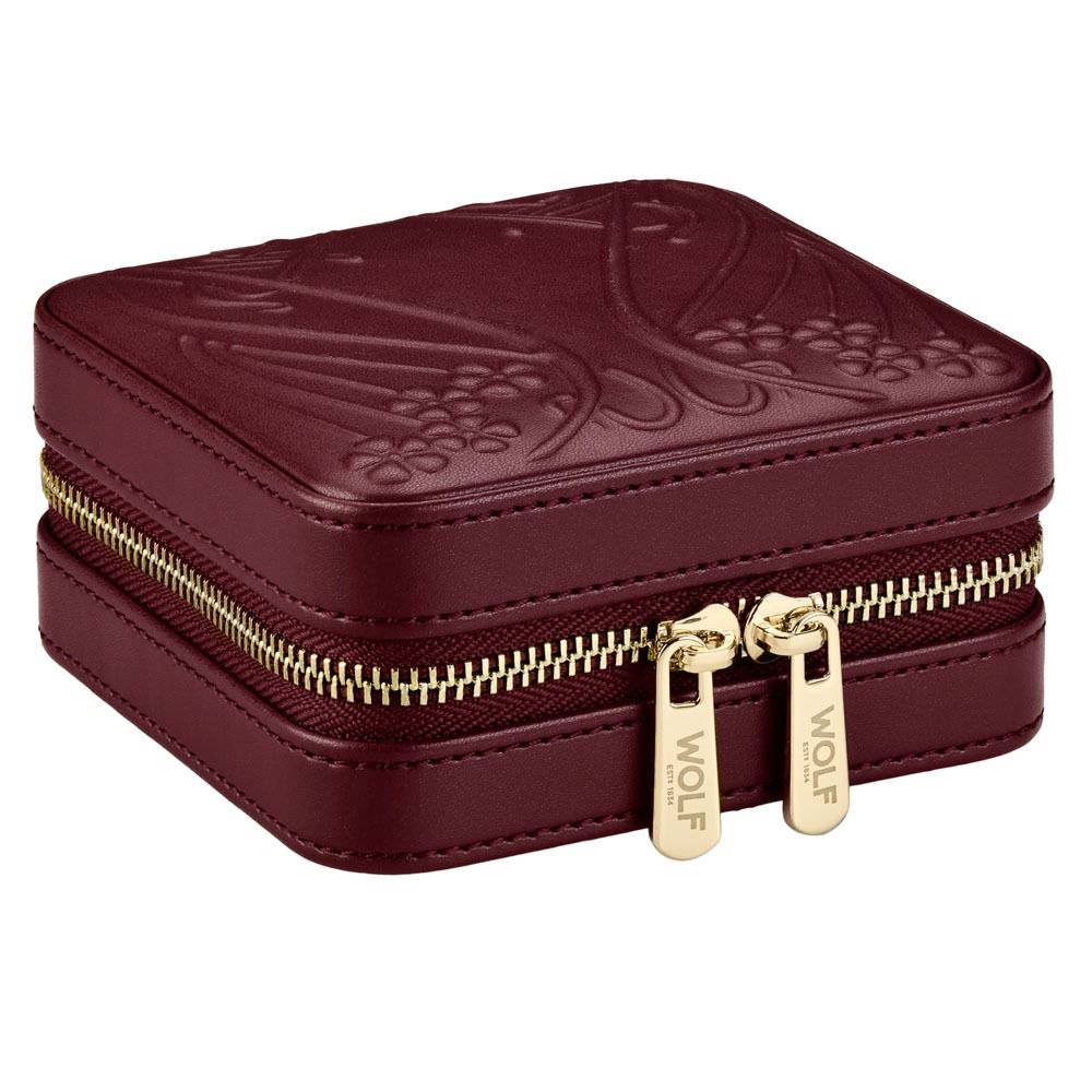 Maroon jewelry box with gold zipper and 'WOLF' branding on a white background