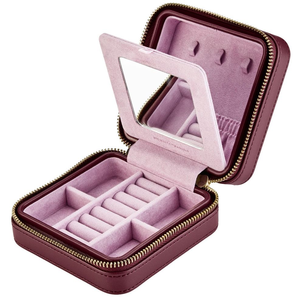 Pink jewelry case with mirror on a white background