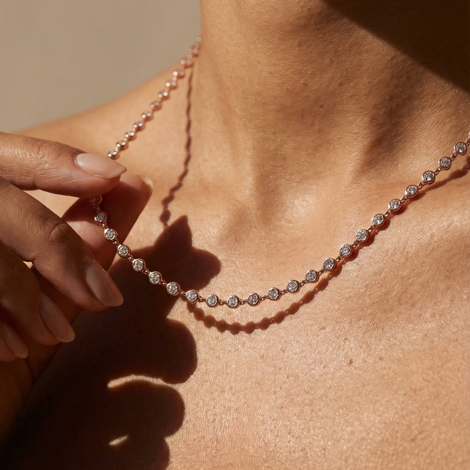 rose gold diamond chain necklace on a model