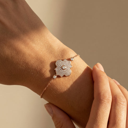 Elegant diamond bracelet on a wrist with a neutral background