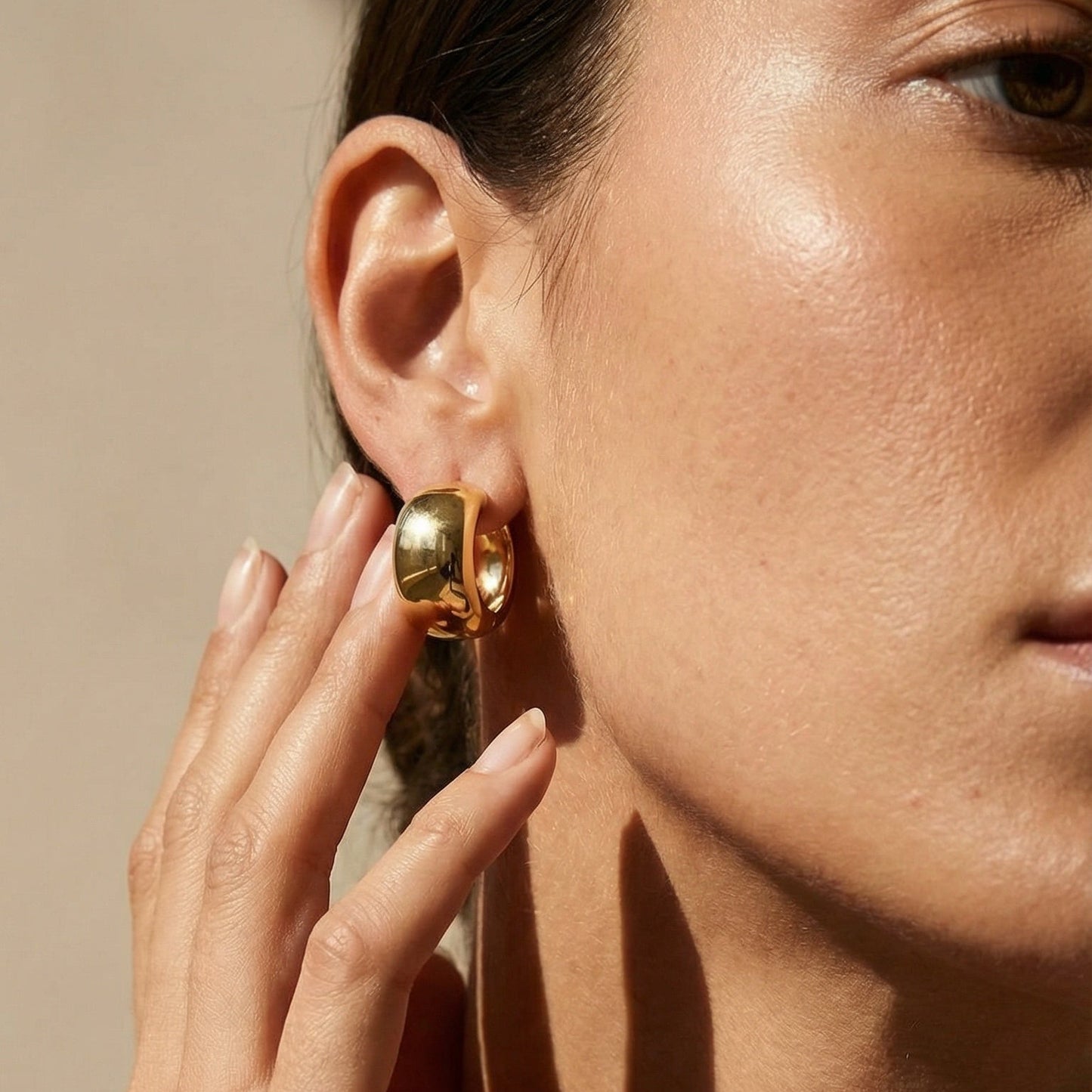 model wearring 18ct yellow gold wide hoops 