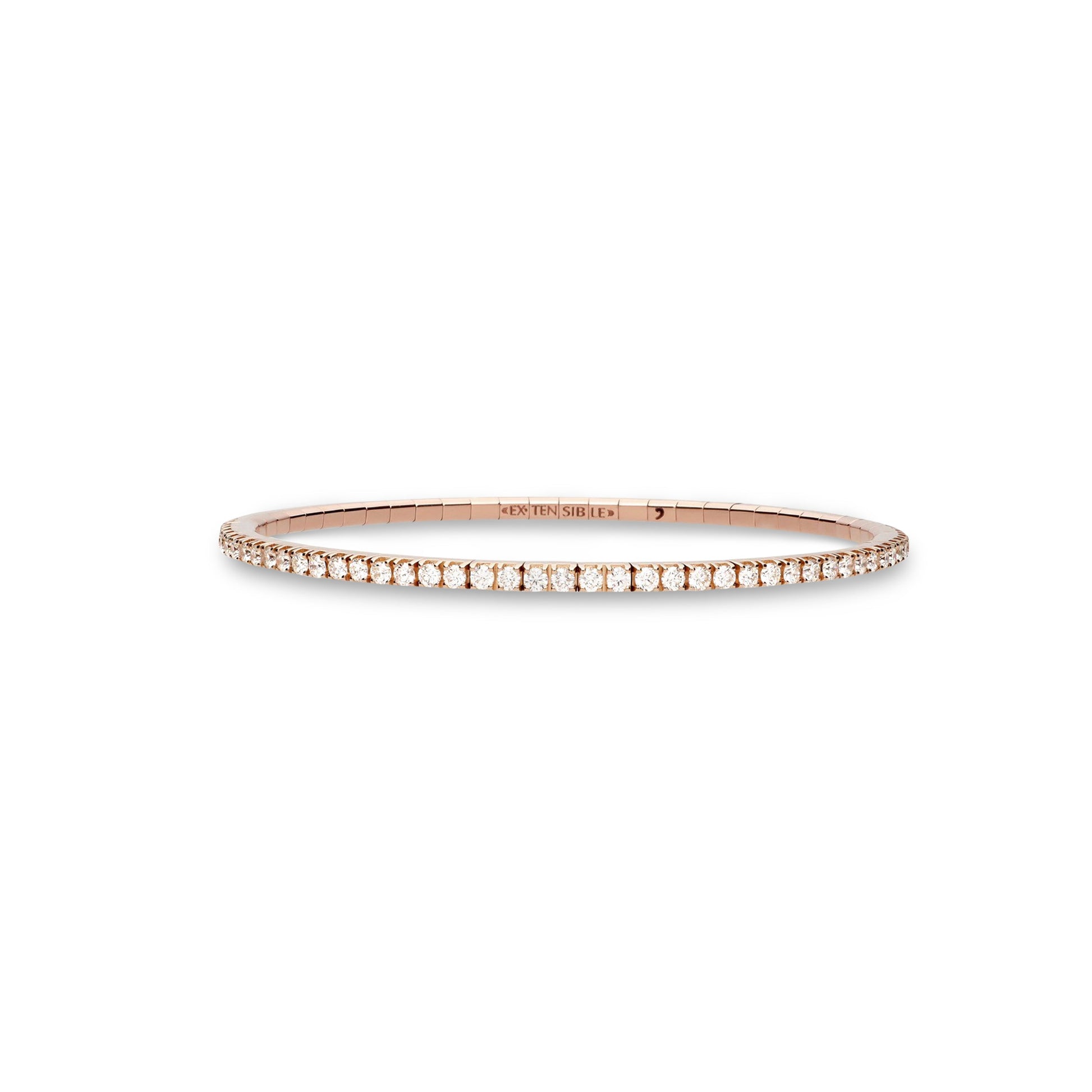 A delicate rose gold bangle bracelet with a single row of small clear stones, centered on a plain white background.