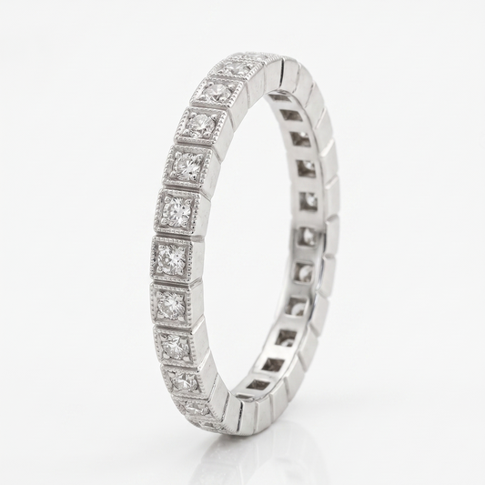 Silver ring with embedded diamonds on a white background
