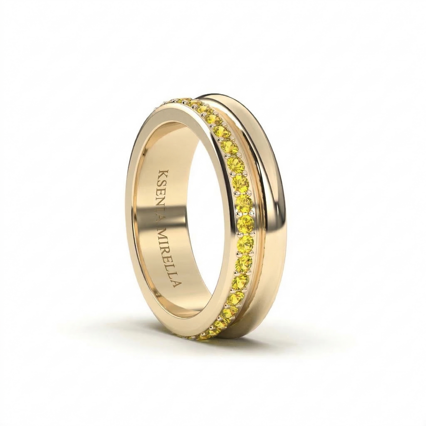 yellow gold yellow sapphire double band eternity ring on a white background