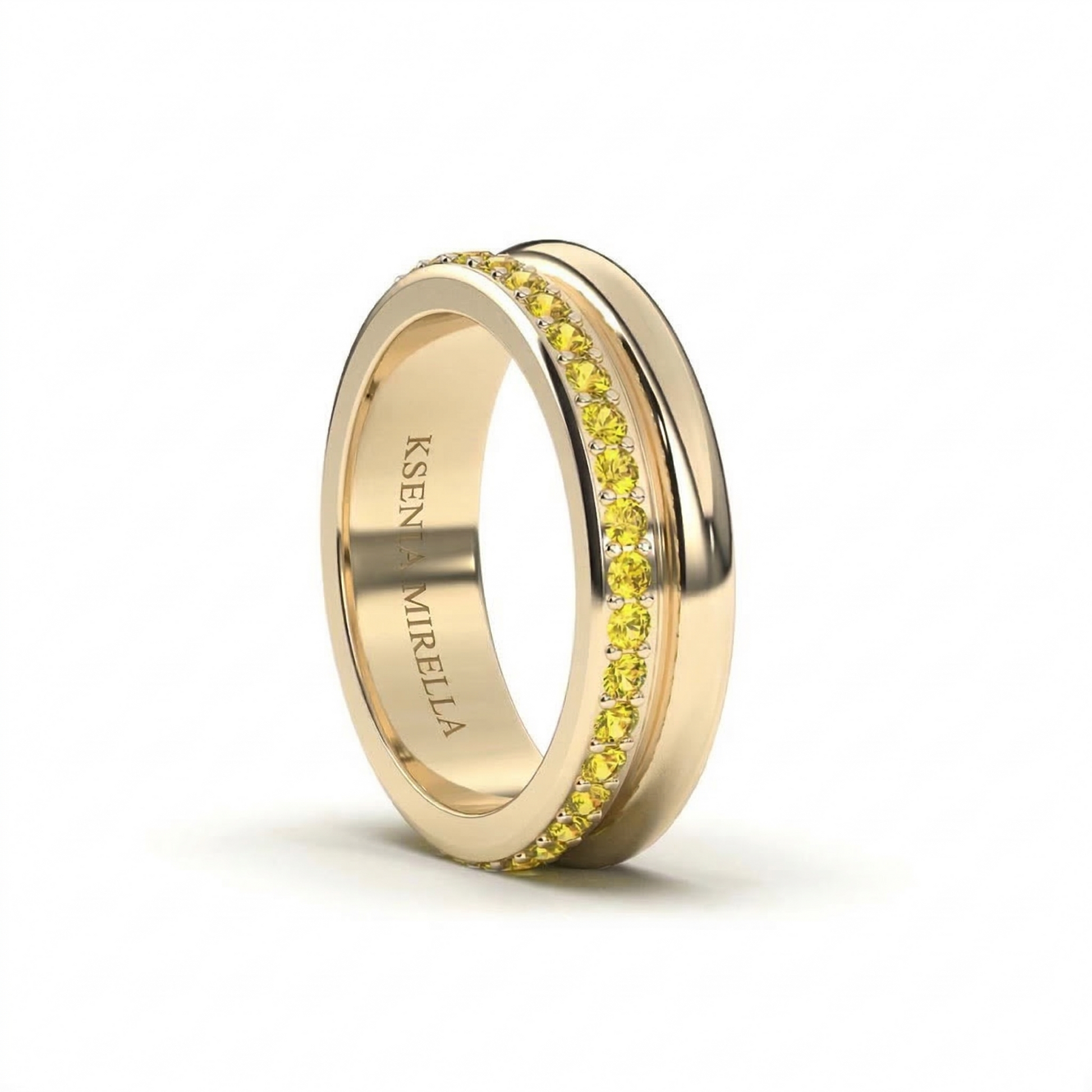 yellow gold yellow sapphire double band eternity ring on a white background