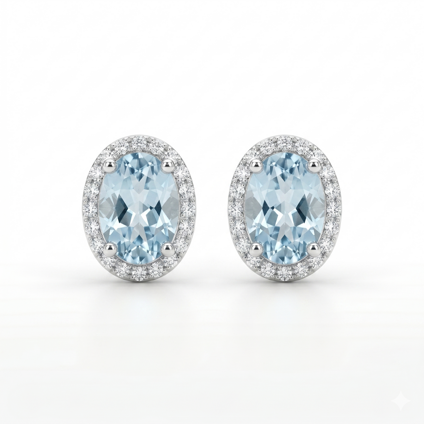 Pair of earrings with blue gemstones on a white background