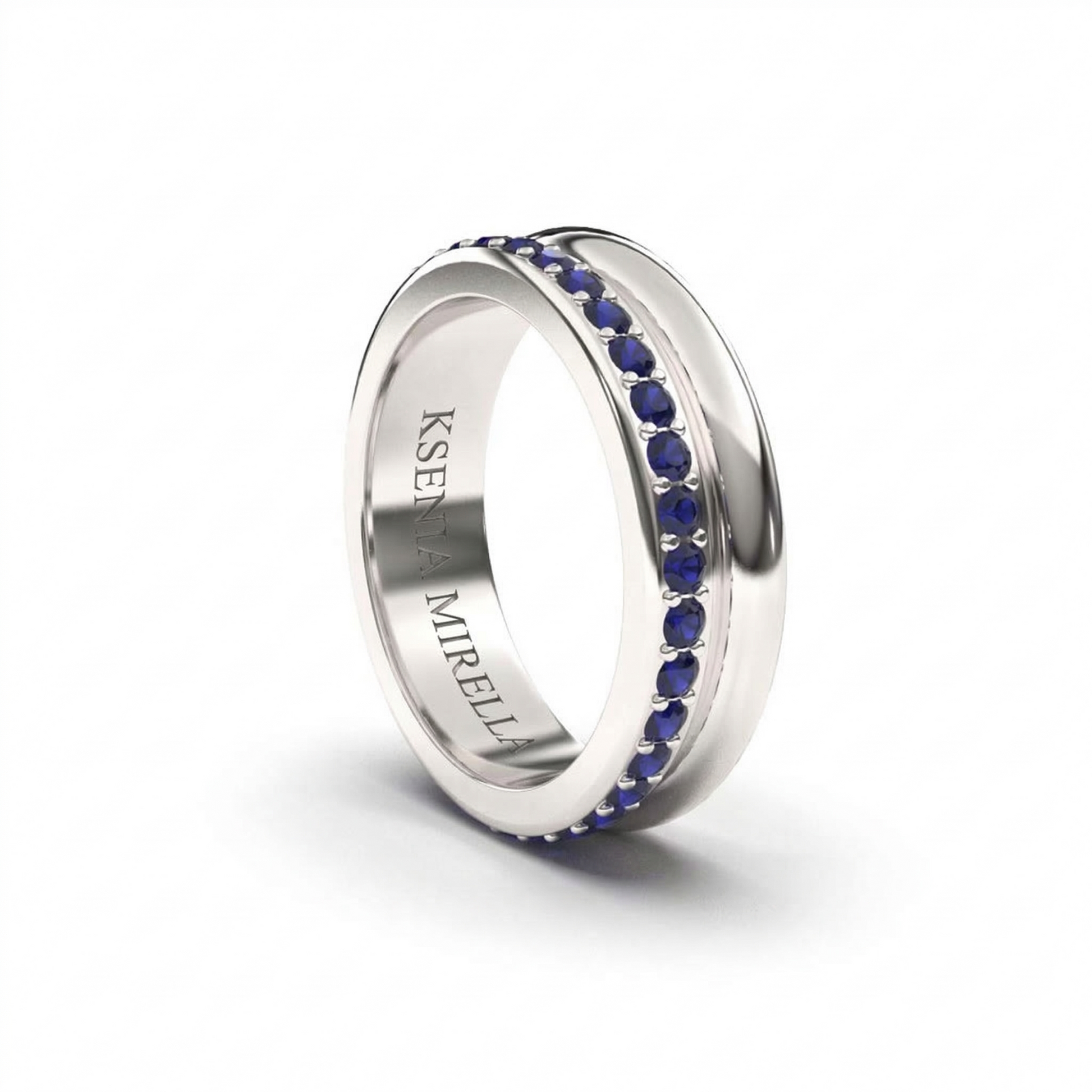 Silver ring with blue stones on a white background