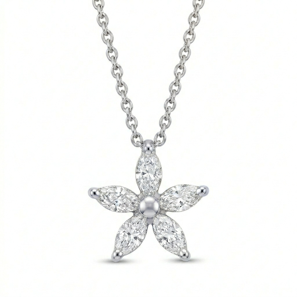 A delicate flower pendant featuring five marquise-cut diamonds as petals, totaling 0.55ct, set in 18ct white gold. High-resolution packshot on a clean background by Peter Ungar.