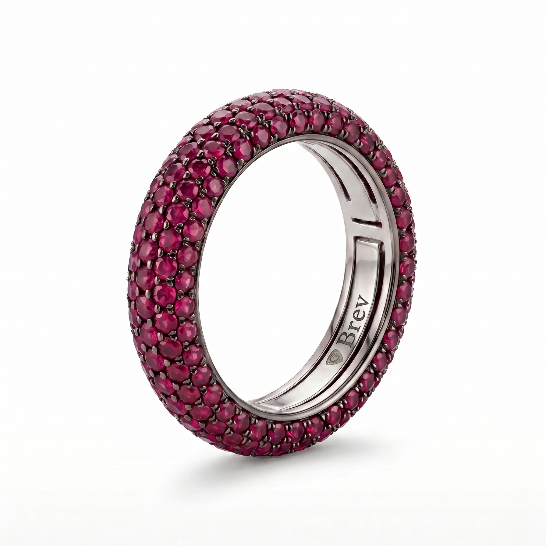 Ring with pink gemstones on a white background