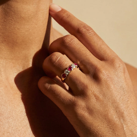 Close-up of a hand wearing a ring with a blurred background