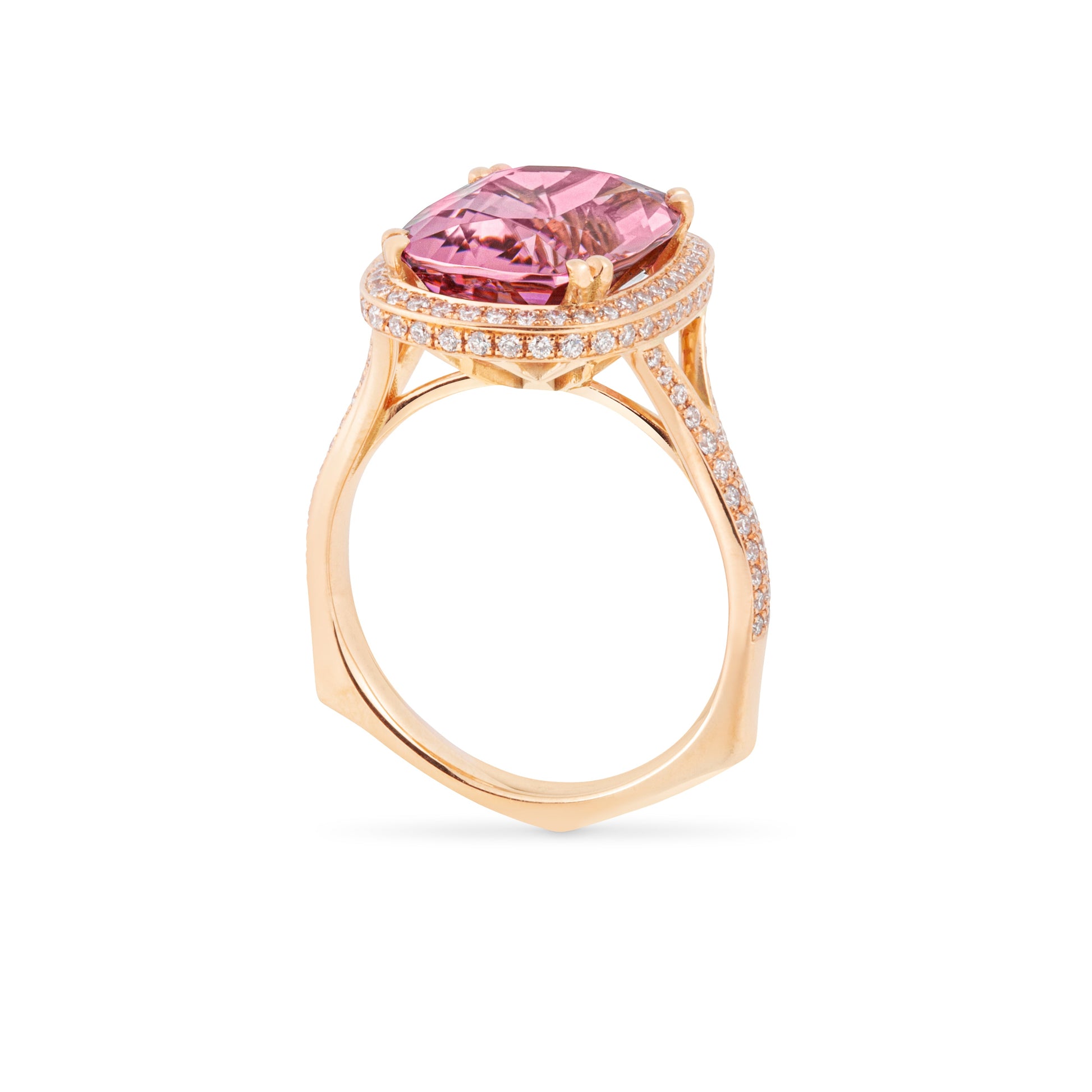 Rose gold ring with a pink gemstone and diamond accents on a white background