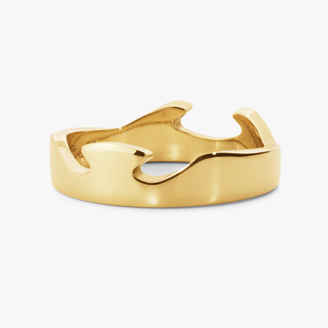 Gold ring with a unique design on a white background