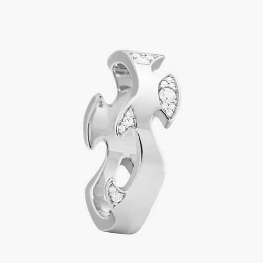 Silver earring with diamond accents on a white background