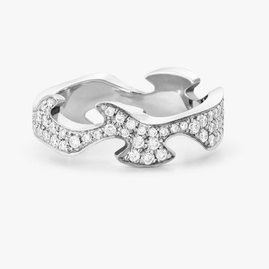 Silver ring with diamond accents on a white background