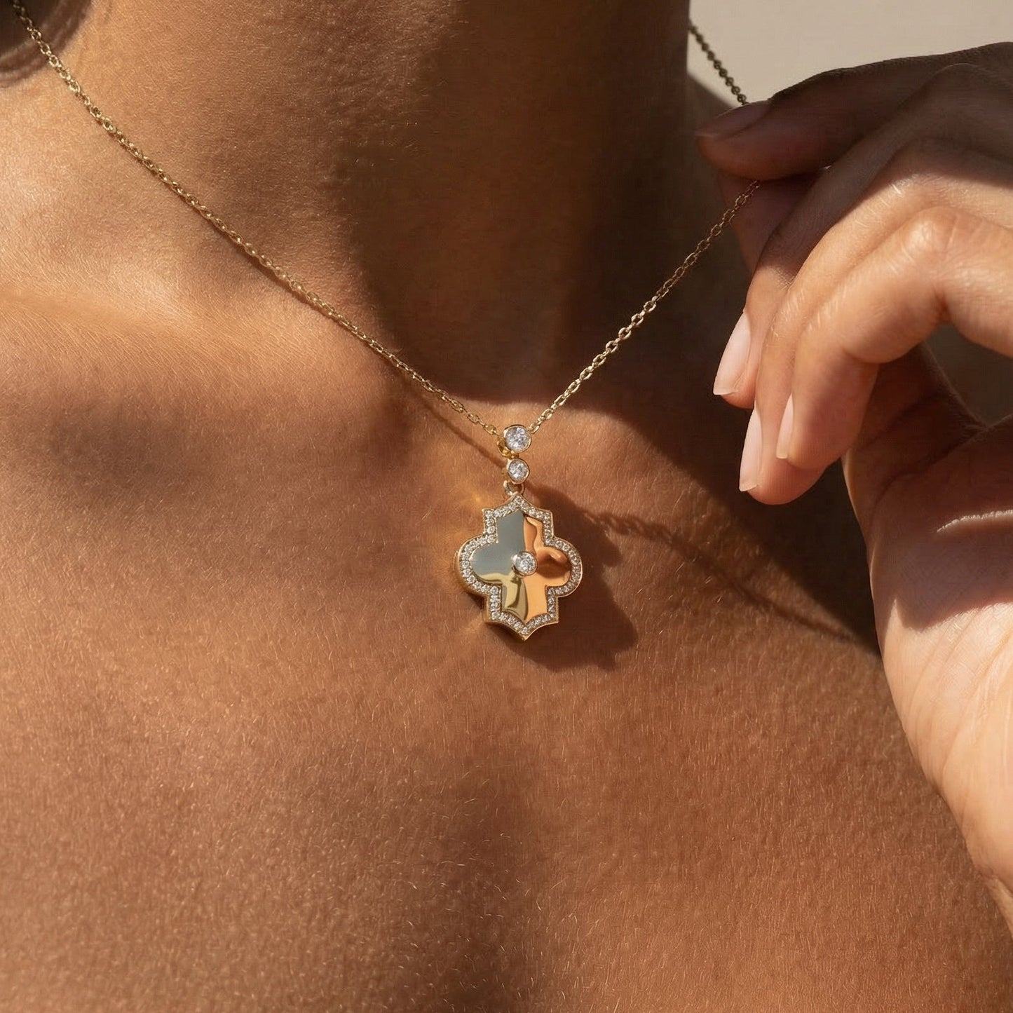Close-up of a necklace with a pendant on a person's neck