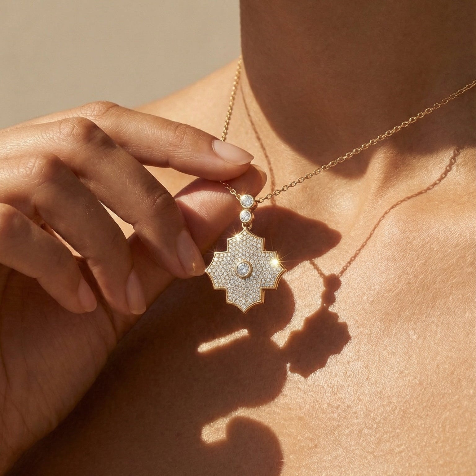 Close-up of a necklace with a pendant on a person's neck against a neutral background