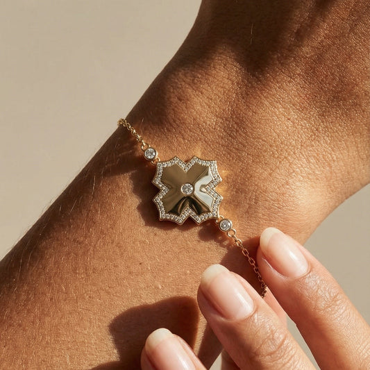 yellow gold white diamond chain bracelet on models hand  