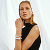 two Georg Jensen silver hinged bangles on a model